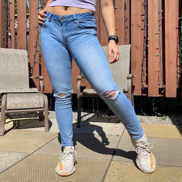 Mid rise blue ripped skinny jeans